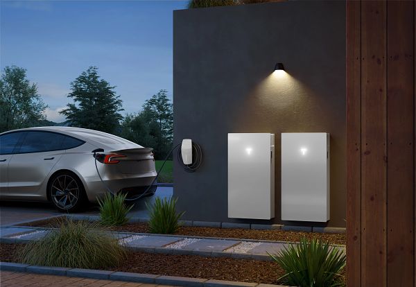 Tesla Wall Connector and Tesla Powerwall 3 installed on house exterior with Tesla Model 3 car charging