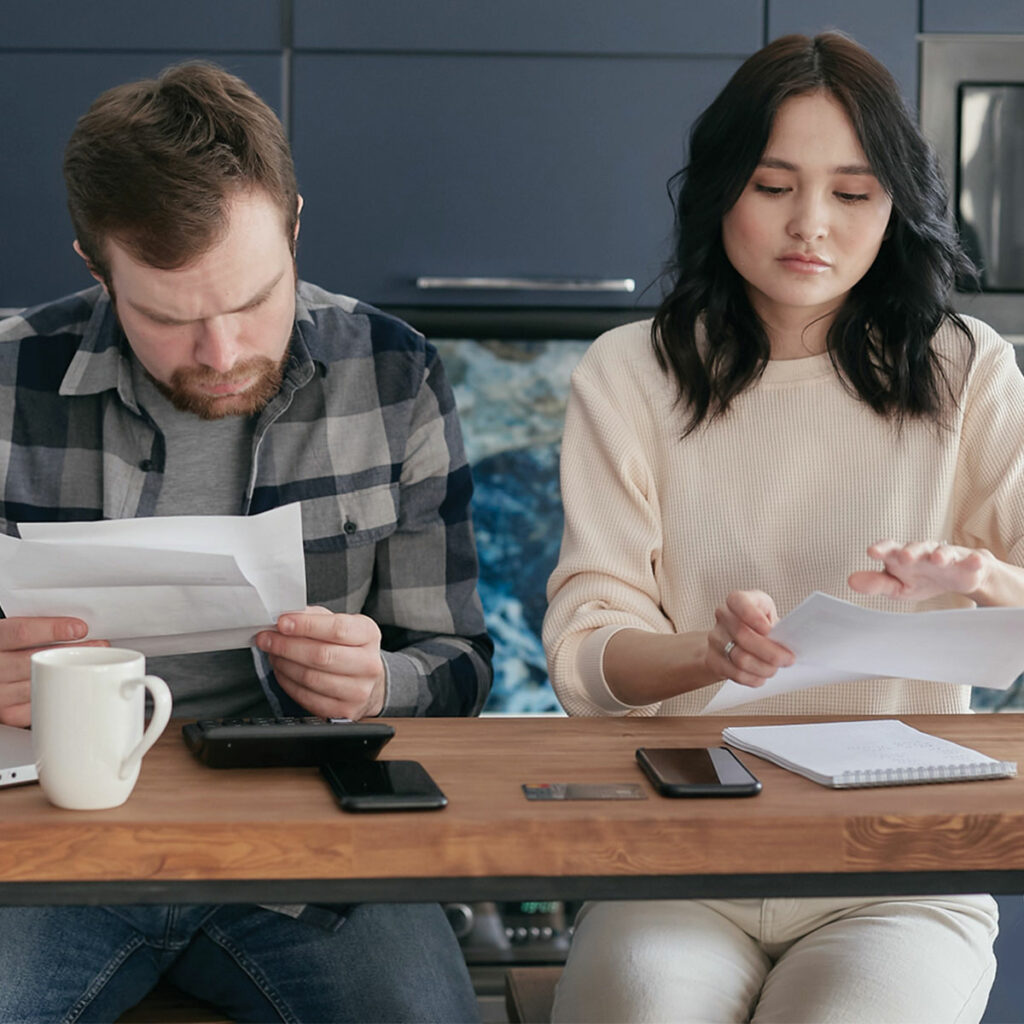 couple looking at their energy consumption bills