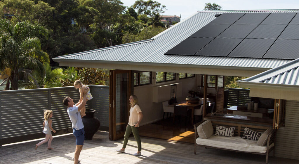 Silhouette solar panels on house